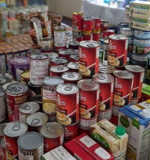 Stacked tins in a free pantry